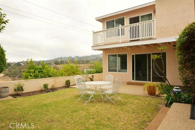 Victoria Knolls remodeled view home seeks family who appreciates long time neighbors. This is view of Private backyard - family room to right sliding doors lead to pebble tech patio and grassy back yard. Top right master retreat balcony.