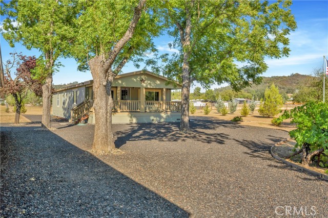 11890 Old Spruce Grove Road Lower Lake, California Lower Lake Ranchette ~ situated in a quiet neighborhood with just over 2 level acres, this unique property has so much to offer! Previously known as the Rancho Sendero water company, 4 wells with plentiful water can be found throughout the property - an excellent resource for potential income or simply use to develop and maintain the landscape. Detached 16x20 garage with 9' ceilings, fully insulated, electricity, roll up door & man door- is a great place to store your vehicle or equipment. 720 SF bonus unit currently used for storage but once was a 2 bedroom / 2 bath mobile home with it's own PGE meter & septic. The well appointed 3 bedroom / 2 bath home has 1,608 SqFt built in 2012. Inside find vaulted ceilings with fans. The spacious kitchen offers formica countertops with tile backsplash, breakfast bar & upgraded cabinetry with loads of storage. Propane range, oven & microwave, garbage disposal + dishwasher. Spacious dining room off the kitchen with ceiling fan and lovely views of the property surrounding. Indoor laundry with utility sink is a bonus! The spacious master includes vaulted ceilings, ceiling fan & an oversized walk-in closet. An ensuite bathroom with double sinks, upgraded cabinetry and convenient linen closet. Enjoy outdoor living on the covered back deck with beautiful views surrounding. The owner is a meticulous retired firefighter and extra attention has been given to fire safety at this home. Wildland Urban Interface compliant = more resistant to wildfire! 4 exterior water spigots, good defensible space around the structures and fire resistant covered porch on the main home. Custom construction upgrades include 2x8 flooring and 2x6 walls, heavier roof with dimensional roof tiles. This incredibly well maintained property in a peaceful setting is one not to be missed! Ask about the furnishings, tractor & mower to be included in the sale if desired! |jn8okVVo9qM