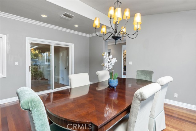 The formal dining room opens to the spacious patio and backyard.