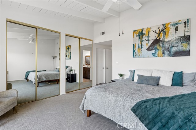 Primary suite has 2 double-door mirrord wardrobes + walk-in closet.