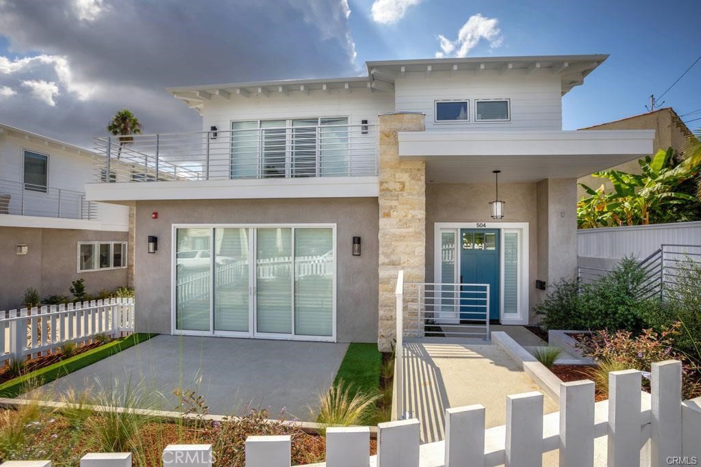 506 25th Street Hermosa Beach, California Welcome to this newer Modern-Chic rear unit townhome in the Hermosa Valley that truly lives like a single family residence. It is a sensational design/build by Kim Komick - KKC Fine Homes. 4 spacious bedrooms and 4 baths are perfectly spaced on 2 levels with warm oak floors, crisp white walls and contemporary light fixtures. The top living floor is light, bright and open highlighting a limestone fireplace as the focal point of the room. The kitchen is stocked with high end appliances and a spacious center island. Folding glass doors invite you to sit out on the upper patio to hear the sounds of nature. Lower level opens to a private fenced yard with sustainable turf and a patio for lounging This lovely neighborhood offers peaceful, private living at its finest, yet you can walk to the beach, park, shops, restaurants & schools within minutes!