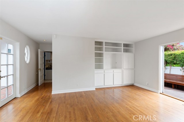 FAMILY ROOM WITH CUSTOM BUILT INS- FRANCH DOORS TO BACKYARD