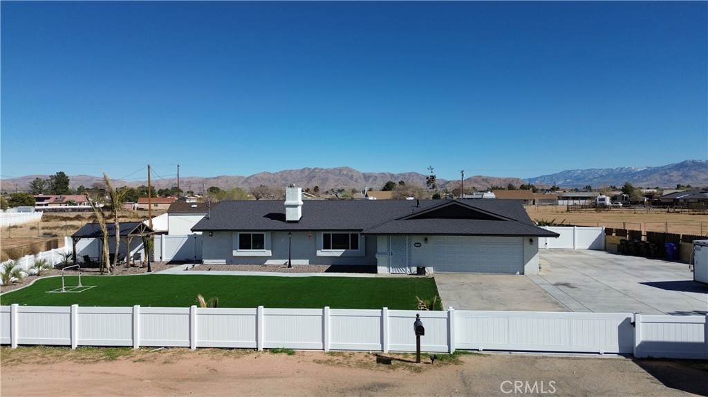 Modern Desert Oasis with Income Potential & Luxury Upgrades!

Welcome to your private retreat in the heart of Apple Valley! This beautifully upgraded single-family home offers resort-style living on a fully fenced 1-acre lot, packed with features and flexibility. The main home boasts 3 spacious bedrooms and 2 luxurious bathrooms, adorned with gleaming marble floors throughout, a custom fireplace, and a modern kitchen with quartz countertops—perfect for entertaining or everyday living.

Step outside to your personal paradise: a sparkling pool with waterfall and slide, soothing jacuzzi, lush landscaping, and a covered patio designed for year-round enjoyment. Love to host or need space for extended family? Two studio ADUs offer endless potential—one permitted and one unpermitted—each with its own A/C unit. One even includes a private entrance, carport, and septic tank.

With over $150,000 in upgrades, including a built-in speaker system, security cameras throughout, and RV access and parking, this home checks every box. The lot is uniquely divided by vinyl fencing—ideal for privacy, pets, or future expansion.

Don’t miss this rare opportunity to own a stunning home with income potential and room to grow. Schedule your private tour today and experience Apple Valley living at its finest!