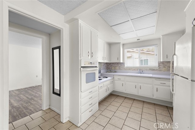 Another view of kitchen showing the opening to the bedroom.