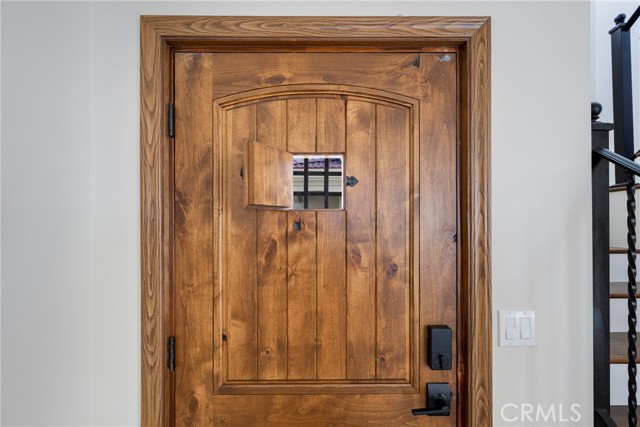 Beautiful custom front door with peephole.