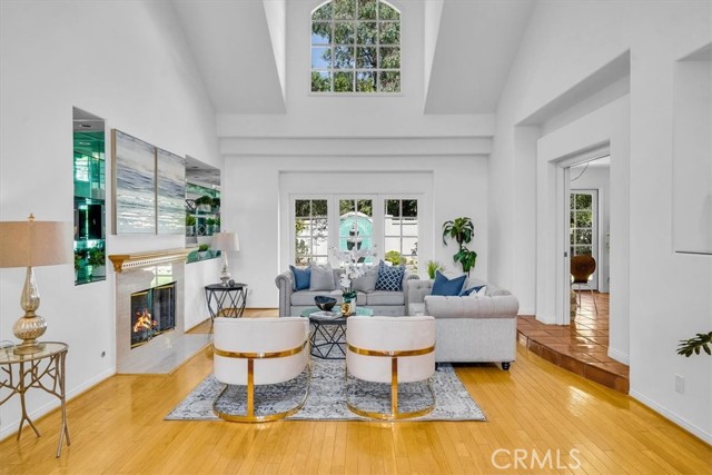 Spacious open and bright living room with high ceilings and cozy fireplace