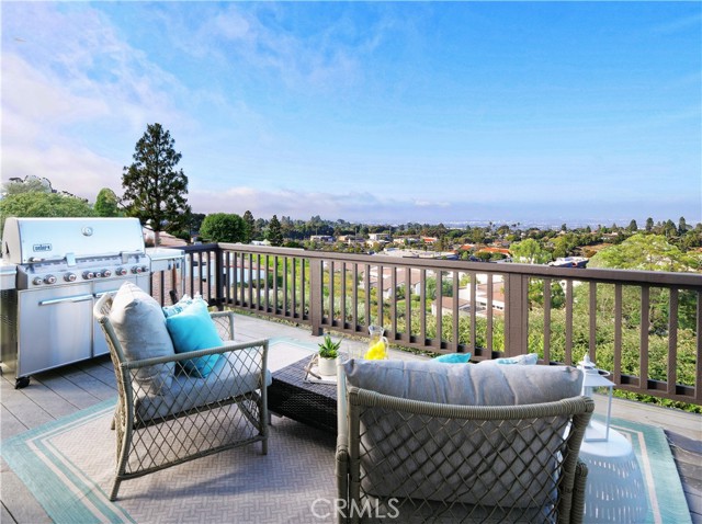 View deck off living room to enjoy the beautiful panoramic views! BBQ grill is included in the sale