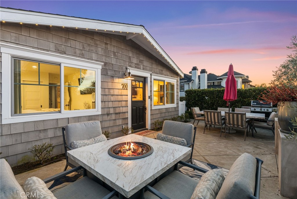 Experience the ultimate beach lifestyle in this charming 2 bedroom, 2 bathroom cottage, nestled in the heart of the Corona Del Mar Flower Streets. Located on a corner lot, this charming single level turnkey cottage exudes quintessential beach living.  From the moment you arrive, the inviting dutch door entry welcomes you into a world of coastal serenity and sophistication.
The large 400 sqft enclosed front patio is elevated to capture the cool ocean breezes and lush greenery providing privacy. The perfect place for hosting summer gatherings or enjoying your morning cup of coffee.  The expansive side yard is an extension of the living space and ideal place for a garden, play yard for your pets, or an additional outdooe seating area.
Inside, the sunlit living spaces exude warmth and relaxation, with an open layout perfect for unwinding after a day at the beach or hosting intimate gatherings. The kitchen, beautifully appointed with modern appliances including a Fisher & Paykel refrigerator, offers ample space.  The primary bedroom is located towards the front of the house offering a charming view of the front patio.  The guest bedroom features a desk nook and has a recently added and a tastefully done bathroom with dual sinks and a stand up shower.
This home is turnkey and equipped with modern comforts, including but not limited to an updated HVAC system, newer AC unit, and integrated surround sound speaker system, and single car garage with driveway parking. Situated just a short stroll from the picturesque park on Jasmine and the vibrant shops and restaurants of Corona Del Mar, this location truly embodies the best of coastal living.  Centrally located, this home is close to John Wayne airport and offers convenient access to the 73 and 405 freeway making it ideal for a work live lifestyle or the perfect home away from home.
Embrace the laid-back luxury of beach life in this one of very few remaining Corona Del Mar cottages—where every day feels like a vacation. Don’t miss the chance to call this seaside gem your own.