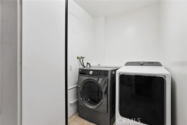 Laundry area adjacent to garage