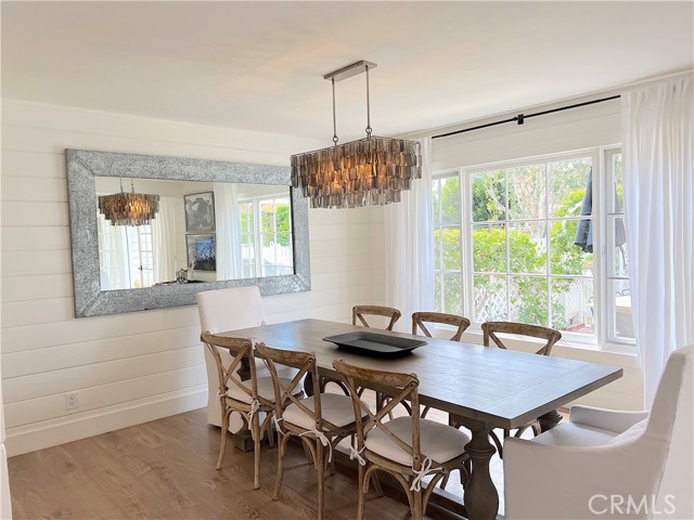 Bright and airy dining room with large window to the patio.