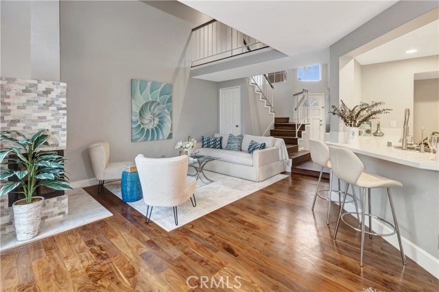 living room, open kitchen, open stairway