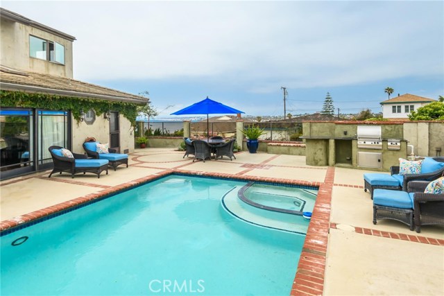 504 Paseo de la Playa Redondo Beach, California Stunning, panoramic Queen's Necklace coastline, ocean and mountain views on one of the best street in the lower Hollywood Riviera! A one minute walk to the beach. The home is situated high up on a corner lot and has a gated, private entry into a beautifully landscaped yard. This home was never intended to be a rental and was extensively remodeled with top quality material. Hardwood floors, custom window treatments, and an open floor plan with lots of double pane windows and skylights bring in natural light throughout the home. The living room has sliding glass doors that open directly out to the backyard entertainment area complete with a sparkling pool, spa, outdoor shower and built-in BBQ island. Three bedrooms, a home office and 2 1/2 bathrooms are located on the entry level. The kitchen is a cook's dream with top-of-the-line appliances, granite counters and a walk-in pantry. Conveniently located next to the kitchen with easy access to the backyard is a laundry room with utility sink and storage cabinets. Upstairs is a private master suite with its own balcony, a walk-in closet, and a recently remodeled master bath with jacuzzi tub and separate stall shower. Adjacent to the master suite is an additional large home office/family room with expansive views, built-in bookcases and cabinets. Walking distance to Riviera Village with shops and restaurants.