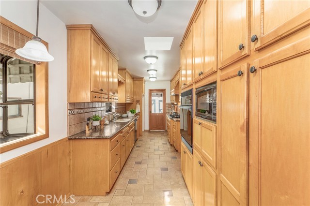 Oversized chefs kitchen with sitting area.