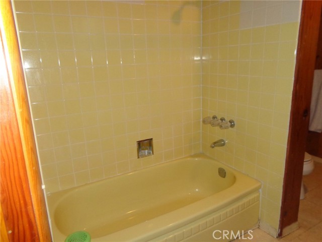 Tub with tiled surround