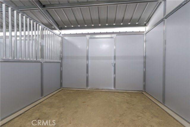All horse stalls are comfortably sized and accessible from both ends.