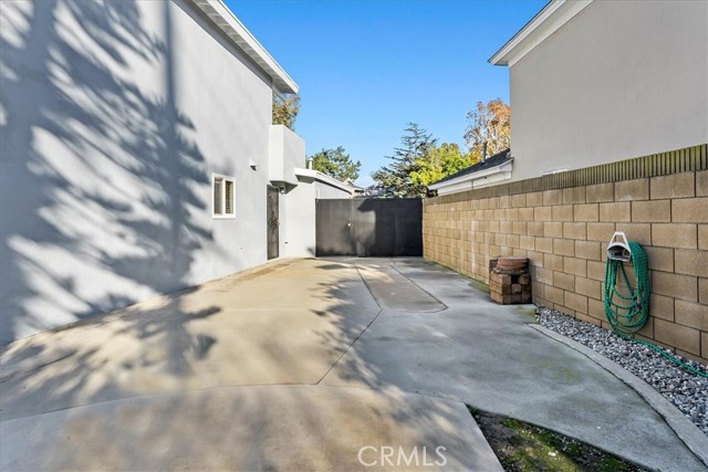 Looking from backyard towards front/side gate.