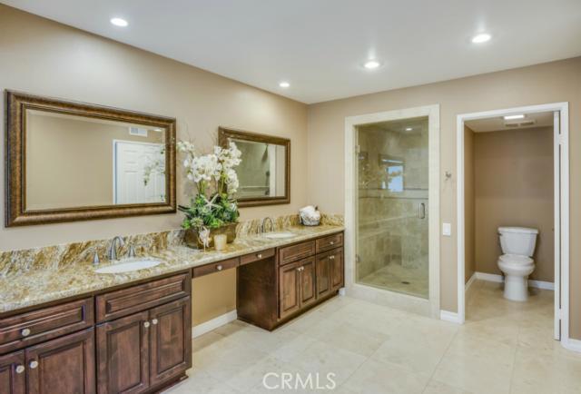 Beautifully upgraded granite counter tops and cabinets plus an over sized shower with bench