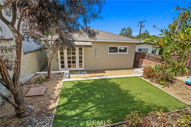 ARTIFICIAL  GRASS & TREX PATIO WITIH AWNING