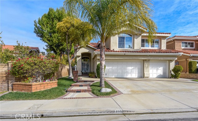 Welcome to the highly sought-after Jasmine Glen Community in Anaheim Hills. Presenting a pristine, two-story residence featuring four bedrooms and three and a half bathrooms, this home is on the market for the first time.

Upon entering through the inviting double doors, you are greeted by a bright, airy foyer with vaulted ceilings that extend into the living and dining rooms. These areas offer French door access to the backyard, creating a seamless indoor-outdoor flow.

The generously sized kitchen is a chef's delight, complete with a large island, double ovens, pantry, and a picture window above the sink that frames a lovely view. Adjacent to the kitchen, there is an additional dining and living space with another door leading to the backyard. The downstairs area is rounded out by a powder room, dedicated laundry room, and access to a three car garage. 

Upstairs, the primary ensuite features a walk-in closet and separate soaking tub and shower. There are two additional bedrooms connected by a convenient Jack and Jill bathroom, as well as a fourth bedroom with its own private bathroom. The home's newer flooring, baseboards, fireplace, and updated kitchen make it truly turnkey.

Take this opportunity to make this exceptional property your new home.