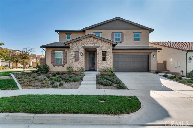 3115 S Claremont Drive Ontario, California NEWLY REMODELLED home in Ontario Ranch. Features VAULTED CEILING on ENTRY, 1 BEDROOM & BATHROOM DOWNSTAIRS, UPGRADED KITCHEN, LOFT, OFFICE SPACE, 9-FOOT CEILING, 3-BAY-GARAGE with painted floor, and SOLAR PANELS to keep your electric bill low. The kitchen has a SPACIOUS ISLAND with GRANITE counter tops, TILE BACKSPLASH, LED cabinet lighting with remote control, and REVERSE OSMOSIS FILTRATION. This house has an OPEN FLOOR PLAN with SPACIOUS FAMILY ROOM. There is a LOFT and 3 OTHER BEDROOMS upstairs. ALL THE ROOMS have LED can lights. ALL BEDROOMS have WALK-IN CLOSET. VINYL PLANK FLOORING downstairs, upstairs loft, bathrooms, and laundry room. In addition to the 5kw SOLAR PANELS that is PAID FOR, this house also has 2 ATTIC FANS. Solar panels have 25 YEARS WARRANTY. SMART HOME automation (wifi hub, front door lock, light switches, thermostat). RING DOORBELL included. ELECTRIC VEHICLE READY 220V NEMA 14-50 plug, 50 AMP BREAKER for Tesla. The house also has FIRE SPRINKLER SYSTEM. Some WINDOW COVERINGS included. Good size BACKYARD with GAZEBO and some plants. Community Association features clubhouse, pool, tot lot, game room, library, BBQ grill, basketball court. Close to schools, freeway, and shopping centers (Costco, future 99 Ranch Market, etc). LOW HOA dues and LOW PROPERTY TAX RATE 1.4% (including special assessment).