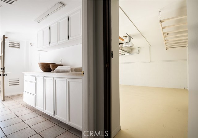 Laundry room with its own service door to driveway.  Loads of storage and workspace