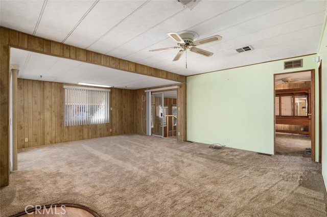 The family room is perfect for both relaxing and entertaining! Sliding doors give to the front porch and another bonus room in the back.