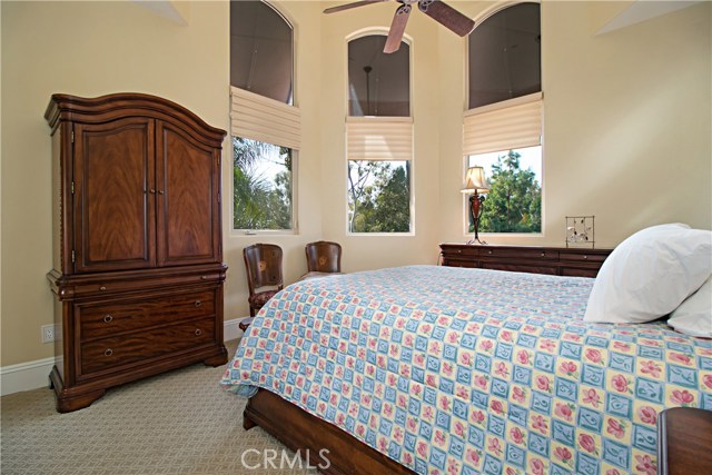 The upstairs bedroom adjacent to the gym is light and bright with grand views.