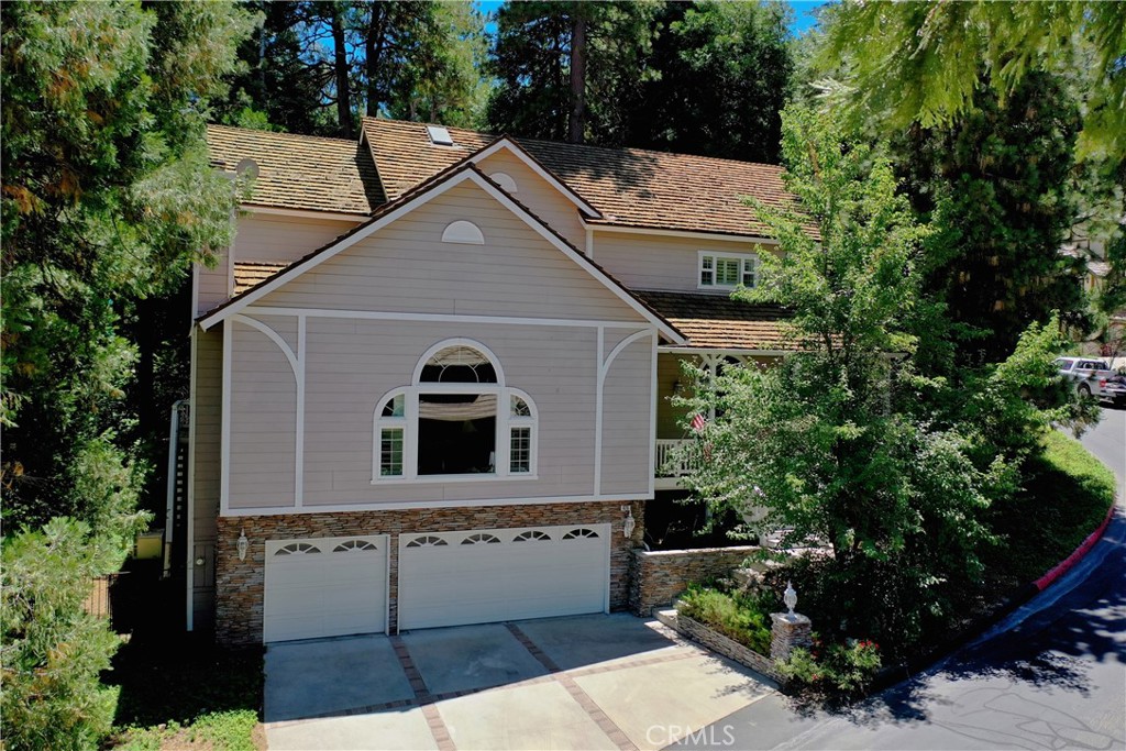 100K PRICE REDUCTION !! SELLER MOTIVATED- Gated Meadow Bay Community with a Half Double Dock only Steps away! Check the Fabulous condition and floorplan in this 2001 Custom Built home. Featuring 4 bedrooms with 3 full baths,  tastefully appointed and in pristine condition. Generously sized living rooms include large Gourmet kitchen with upper end appliances, pull out cabinetry, immense storage space, walk in pantry, breakfast nook with fireplace, even a Gaggenau built in steamer.  The formal adjacent dining area opens to decking for indoor/outdoor entertaining.  The spacious Great Room has vaulted ceilings, oversize custom windows, self contained bar and one of three tastefully designed fireplaces. The finish work is high end for the era of construction with an architecturally custom stairway design and traditional living spaces. The Primary suite is as comfortable as they come with privacy balcony, fireplace, spa like bath, huge walk in closet, and a sitting area for couch or desk. Level entry to An attached large three car garage also with rear build up space for expansion and outdoor access to a level and fenced yard.  Only two doors off the lakes edge, and literally only a few minutes walk to dock and lake.  Enjoy fishing, paddleboarding, boating right out your backdoor!  This flexible home that could work for both full or part time living is in one of Lake Arrowhead's most coveted communities lending itself to easy commuting, continuous live guard patrol, no short term rentals, convenient to Country Club, Dining, and Shopping. First Class Resort Living is this home's moto.  Motivated Seller has upgraded and is offering this for home for immediate offers and sale which also Includes a Seller inventory of furnishings. (A Hurricane Pontoon boat Avail separately).  Call for appointment, Easy to show, and won't last.
