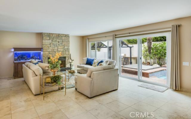View of the family room with fireplace and doors to the outside
