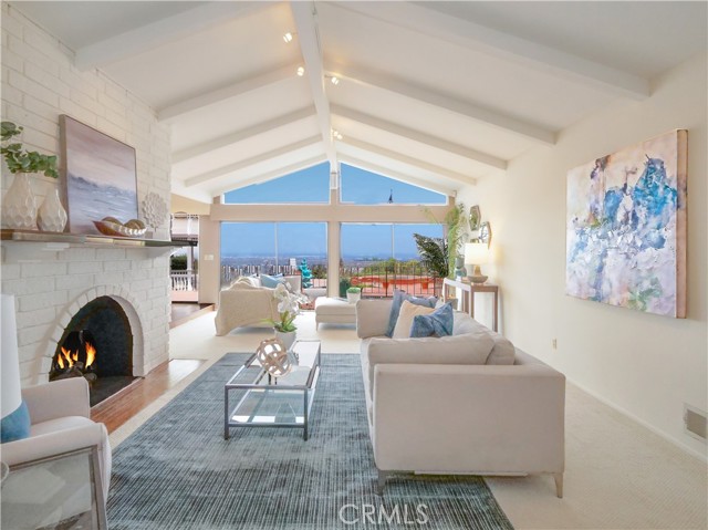 Formal Living area showing 2 separate seating areas closer t view with sliding glass door