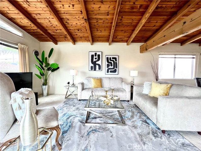 Living room with valuted  beam ceiling