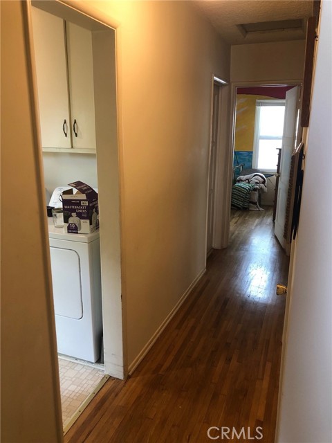 Hallway with laundry room to the left