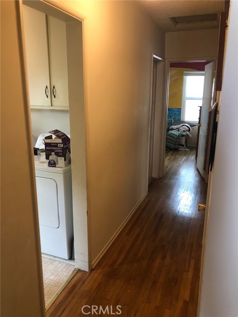 Hallway with laundry room to the left