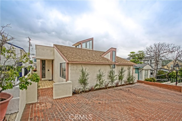 511 Marine Avenue Manhattan Beach, California Located in the coveted Gaslamp District in the Manhattan Beach Sand Section, this 2,353 sq foot home sits on a OVERSIZED 40' X 106' street-to-alley lot. With its unique architecture and hip vibe, this home has tons of potential. The master suite opens to a massive roof deck with mountain and Downtown LA views. There are two living areas, dining room, and two large courtyards for entertaining. Oversized garage, with workshop area, separate laundry room and parking for 5+ cars at the beach! The location is right in the middle of the action, just steps to award winning Grandview elementary, Live Oak park, downtown Manhattan Beach, and of course the sand!