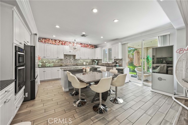 Custom stone breakfast nook attached to the island.
