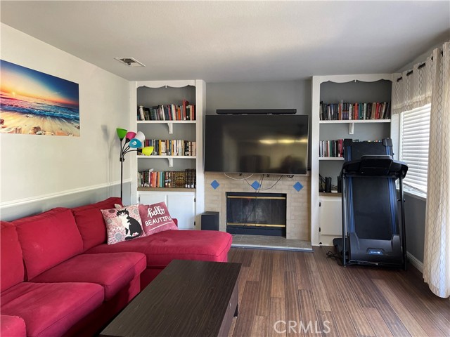 There are built in cabinets on either side of the fireplace.