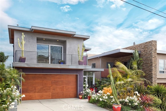 Contemporary masterpiece in Hermosa Beach - custom wood garage door, lush landscaping on a quiet street with great neighbors.