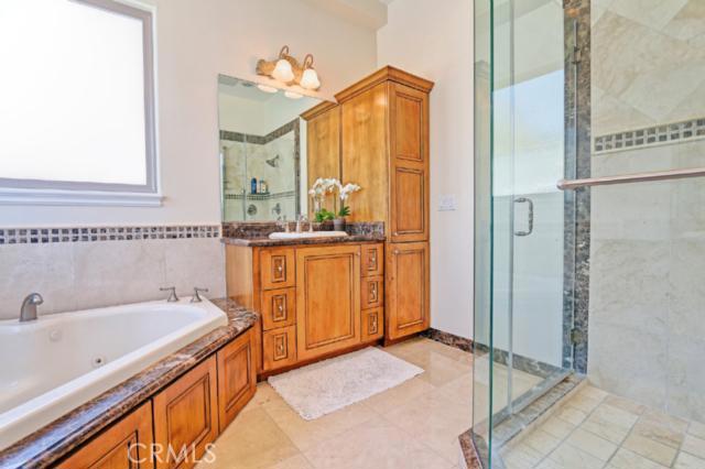 Frameless shower to the right and a better shot of the hot tub to the left. Frameless shower to the right and a better shot of the hot tub to the left.