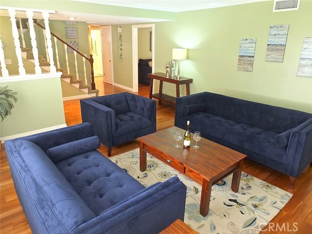 The Generous sized living room features beautiful high end baseboards and Plantation shutters The Generous sized living room features beautiful high end baseboards and Plantation shutters