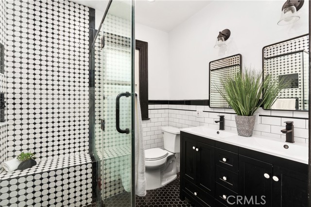 This walk in shower has a nice shelf too!