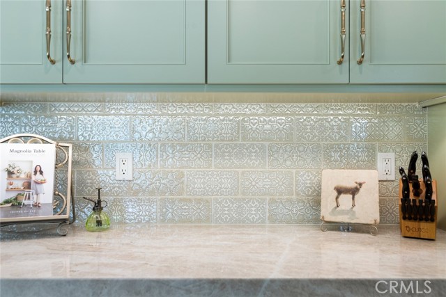 The Italian tile back splash and quartzite stone counter top pair perfectly together! The intricate yet classic design of these custom cabinets are timeless.