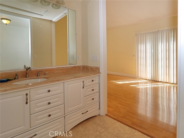 Bathroom Vanity and Master Bedroom French Doors to patio.