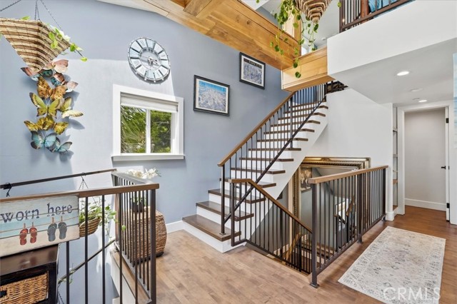 Down the stairs are Primary suites. Up the stairs is the loft.