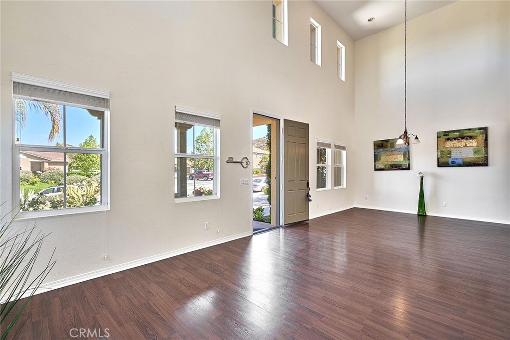 25955 Via Sarah Wildomar, California Elegant former Model home with Upgrades throughout! Bright/open floor plan. The exterior of the home displays excellent curb appeal with an extra-long driveway. 3139 Sqft. 4 Bedrooms Plus a large loft with 3 bathrooms. You are greeted by an open spacious living room featuring soaring ceilings with laminated flooring. 1 bed/ 1 bath on the main floor. Kitchen with Large island & granite countertops, and opens directly to the Comfortable and stylish family room with a gas fireplace. Master bathroom with Large size walk-in closet and closet organizers. Plenty of storage and recessed lighting. Custom window coverings and Shutters, Ceiling fans throughout. Low-maintenance huge yards, Great opportunity of building your very own oasis and dream backyard, as this home sits on 13504 square feet lot. Convenient location, and Easy access to major freeways, close to schools, markets & shopping centers.