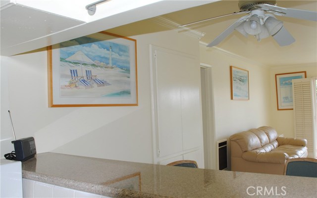 Granite counter top and pass through to dining area and living room.