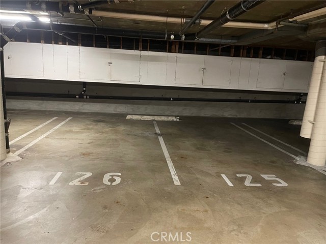 2 side by sie parking spots with storage above each one.