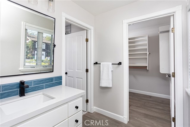 Primary bedroom walk-in closet.