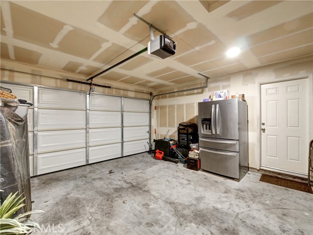 New garage door,  opener and drywall