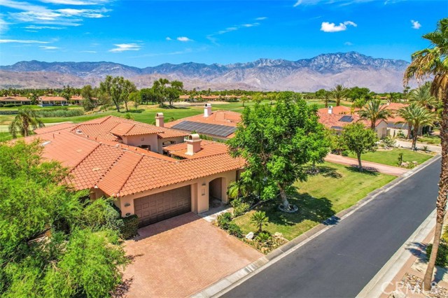 212 Loch Lomond Road Rancho Mirage, California Upgraded single level home with spectacular Southwest mountain views in Legacy at Mission Hills Country Club in Prestigious Rancho Mirage. Enter the custom gate into a courtyard to a double door glass entry. Walk into the Great Room which features 12 foot ceilings, travertine floors, a sunken bar, fireplace, and formal dining room. Step into the Gourmet Chef's kitchen with an Island spacious enough for friends and family to join in the cooking. Kitchen features a walk-in pantry, granite countertops, stainless steel appliances, and built-in desk/office area. Kitchen opens up to the family room with ceiling to floor windows and glass door with stunning South and West mountain & Pete Dye Fairway Golf Coursegolf views. Access the large patio area with expansive lawn and pool and spa. Master Bedroom Suite with access to pool terrace, Spa-like Master Bath with two walk-in Closets and Travertine Finishes. Two Guest Rooms with En-Suite Baths and a large, Glamorous Casita with fireplace and refreshment center complete this desert oasis. Plentiful citrus trees line the private side yard. Ownership in Legacy includes Mission Hills Country Club social/fitness membership. This desert gem awaits you for year round fun in the sun. ********