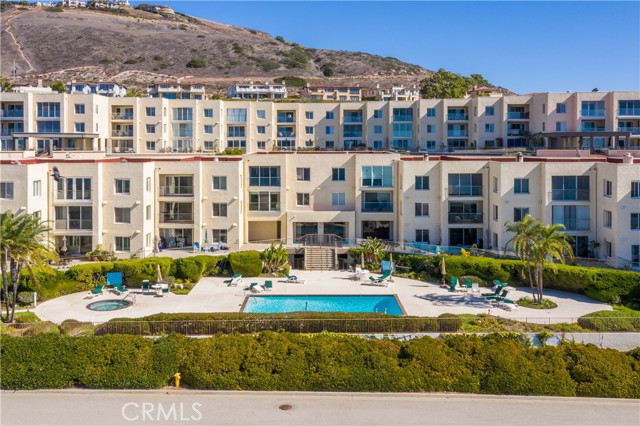 Ocean Terrace community amenities including sparkling ocean view swimming pool and spa, tennis/paddle court, shuffleboard, sauna, gym/exercise room, with a community clubhouse with kitchen facilities.